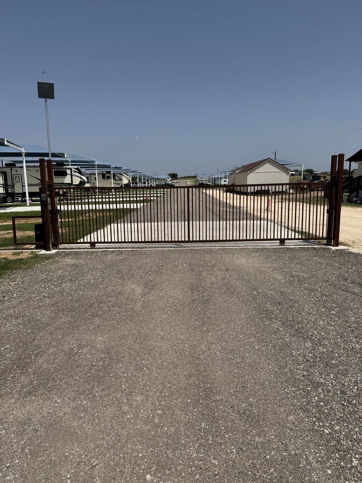 Automatic security gate and covered RV sites at Shade Stop RV of Floresville